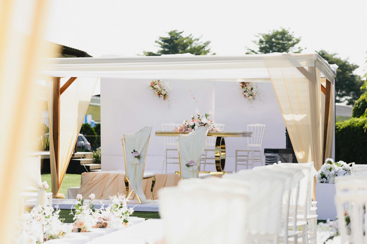 featured-images-01 Beautiful outdoor wedding ceremony setting with white and pastel-colored decor and floral arrangements.